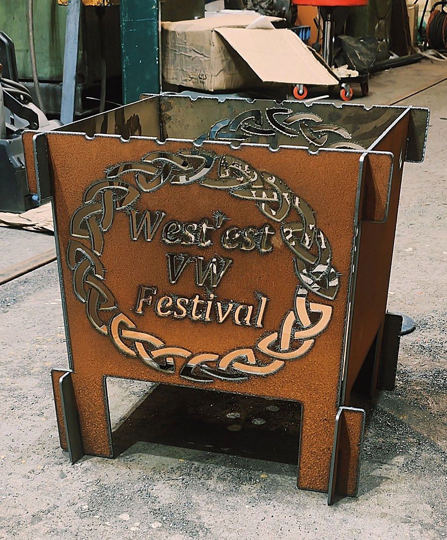 A custom festival fire pit with Celtic wreath lettering, fresh off the table